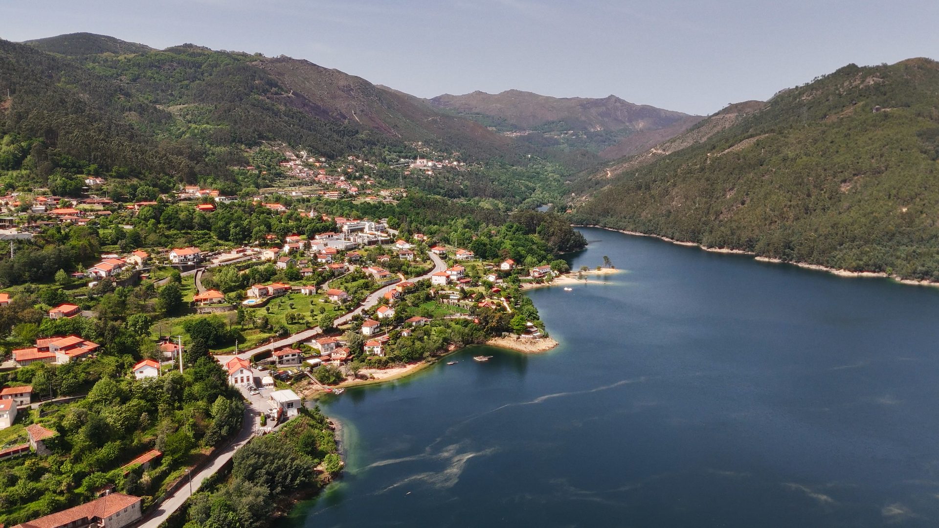 Aerial view of a river valley and village in Minho
